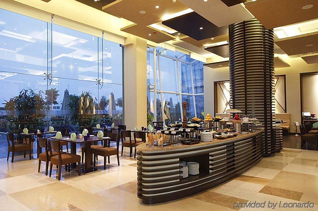 รามาดา พลาซา บาย วินด์แฮม ปูเน่ ฮินเจวาที Hotel Dapuri ร้านอาหาร รูปภาพ
